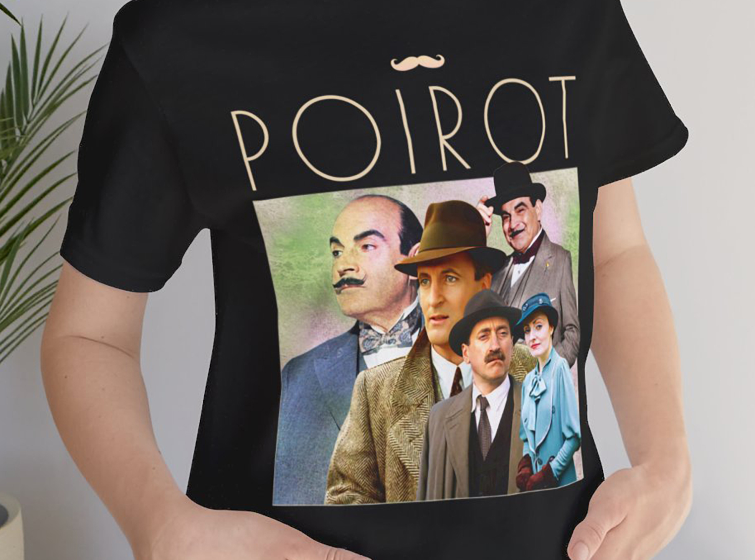 Step back in time with our 1990s Retro Style Hercule Poirot Unisex Bella Canvas T-Shirt! Featuring the iconic Belgian detective, this vintage-inspired tee is perfect for fans of Agatha Christie's classic mysteries. Made with premium Bella Canvas fabric, it offers unmatched comfort and durability. Whether you're solving mysteries or just love retro fashion, this Hercule Poirot tee is a must-have addition to your wardrobe. Shop now and channel your inner detective in style!