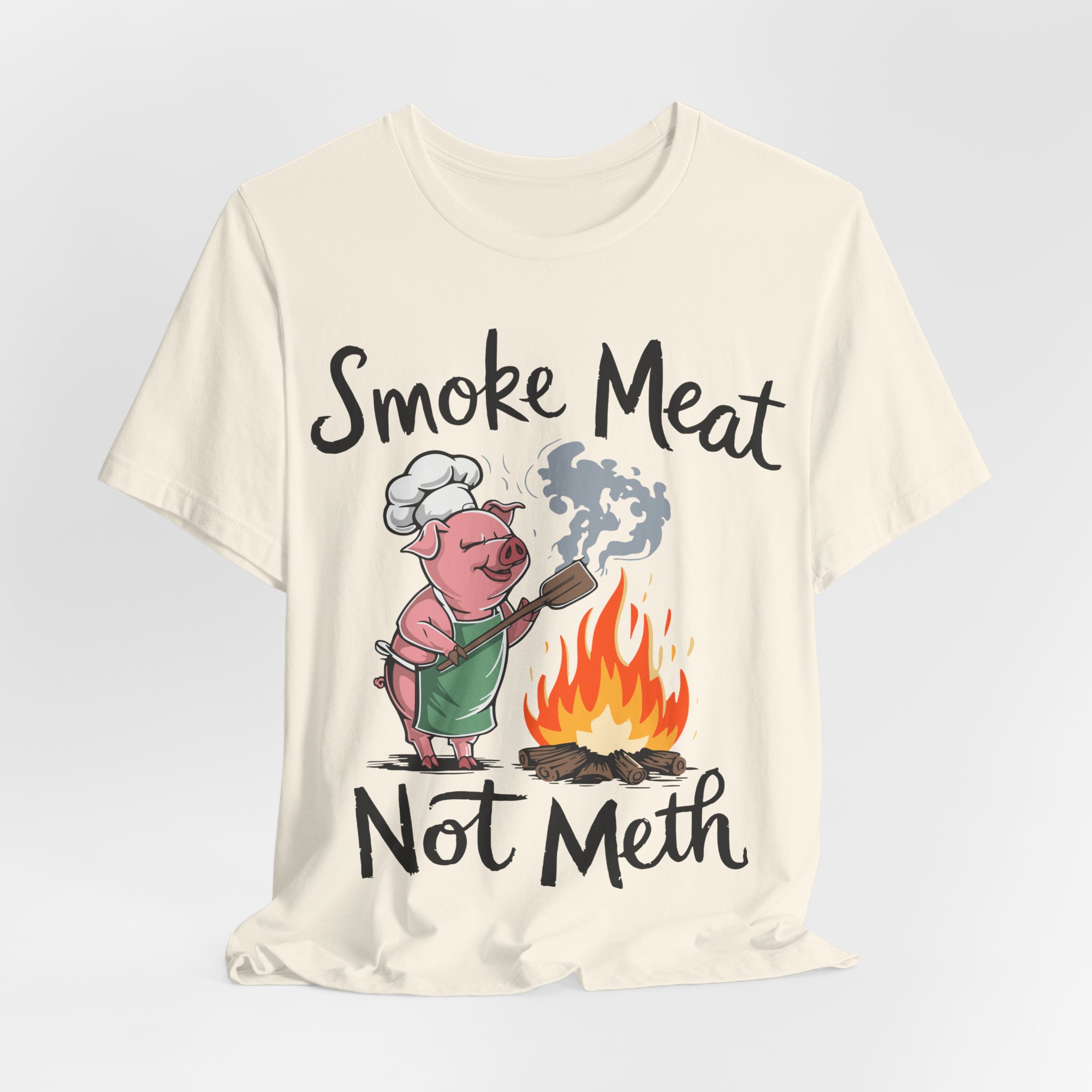 Natural color This funny BBQ-themed tee showcases the playful phrase 'Smoke Meat Not Meth,' making it a great gift for grill enthusiasts or anyone who loves quirky foodie apparel.