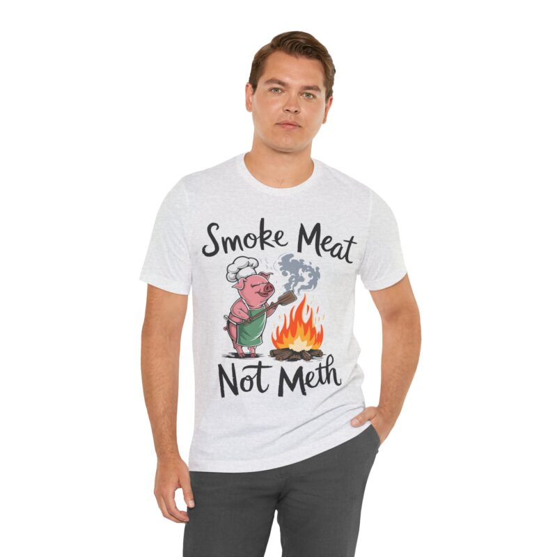 Show off your love for BBQ with this cheeky 'Smoke Meat Not Meth' t-shirt, a must-have for grill masters and foodies who enjoy a good laugh at summer parties.